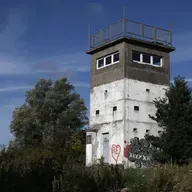 S8 Ep242: Professor Matthew Longo. Longo describes the tension at the campsite where East German refugees, monitored by Stasi agents, gathered. He recounts the chaotic border breakthrough, highlighting the moral choice of Hungarian guards who allowed refugees to cr